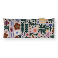 A rectangular aromatherapy eye pillow by Samsé Mérisset featuring a colorful folk-art style botanical and bird pattern on a light beige background, shown against a plain white studio backdrop.