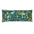 A rectangular aromatherapy eye pillow featuring a detailed botanical pattern of green, teal, and yellow leaves with small white and pink flowers on a dark green background.