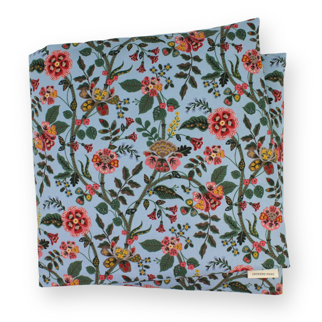 Large aromatherapy hot or cold wrap featuring a dense floral and botanical print on a dusty light blue background. The pattern includes pink, red, orange, and yellow flowers with green leaves and stems.