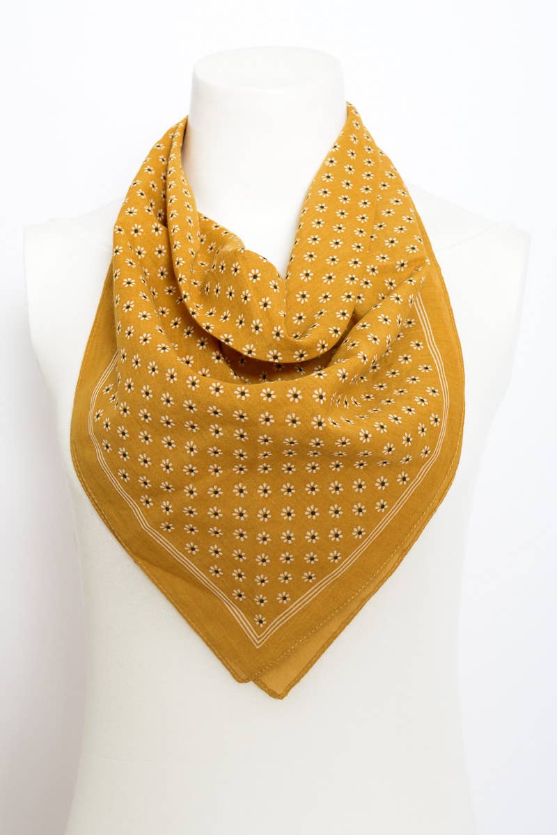 Yellow bandana with a pattern on a white mannequin