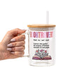 Clear mug with wooden lid and straw, featuring a definition of 'booktrovert' and an illustration of a book with flowers on a white background.