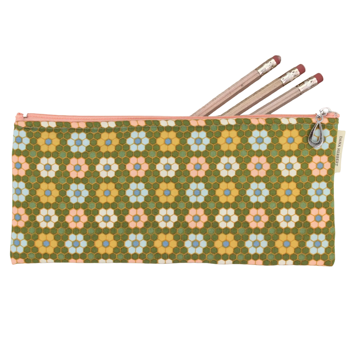 A rectangular zipper pouch with a retro-style floral pattern in olive green, yellow, pink, and light blue, shown on a light gray wood background with three pencils tucked inside.