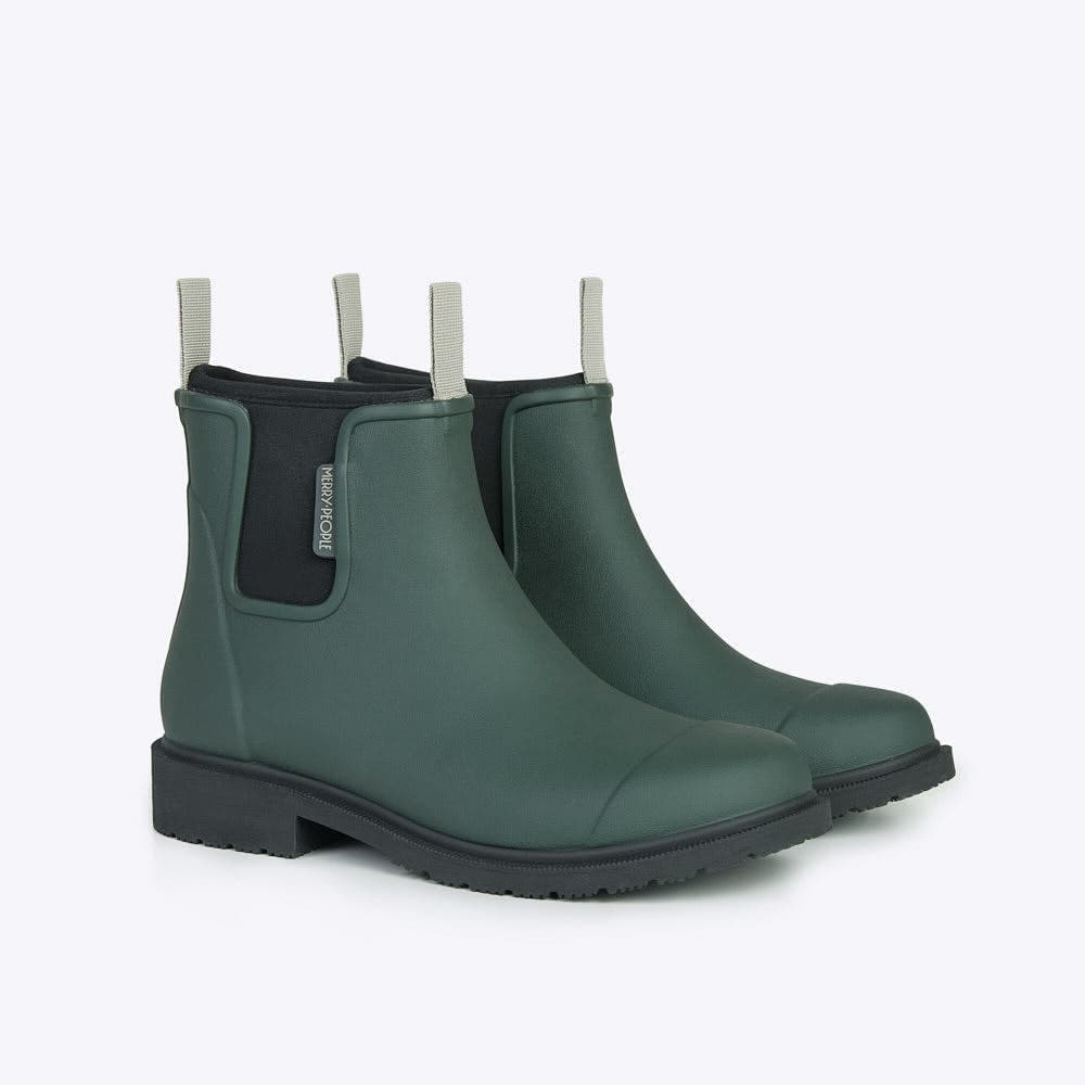 Pair of green rain boots with black neoprene lining and traction sole on a white background