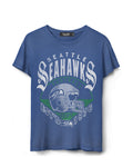 A blue short-sleeve crewneck t-shirt featuring a distressed Seattle Seahawks graphic on the front, including a football helmet and the team name in white and green.