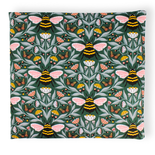 Small aromatherapy hot or cold wrap featuring a detailed botanical and insect pattern on a dark green background, with pink-winged bees, butterflies, flowers, and leaves.