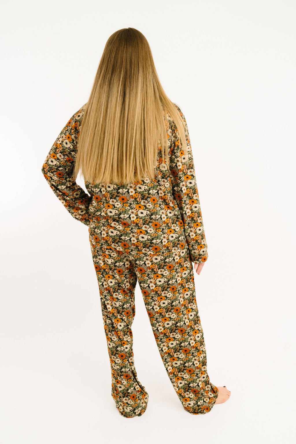 Back of person wearing matching pajama top and bottoms.