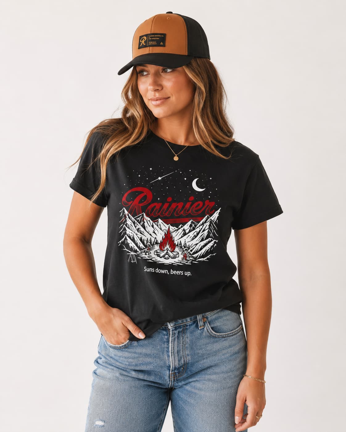 Woman in glow in the dark Rainier Beer graphic tee and snapback hat.