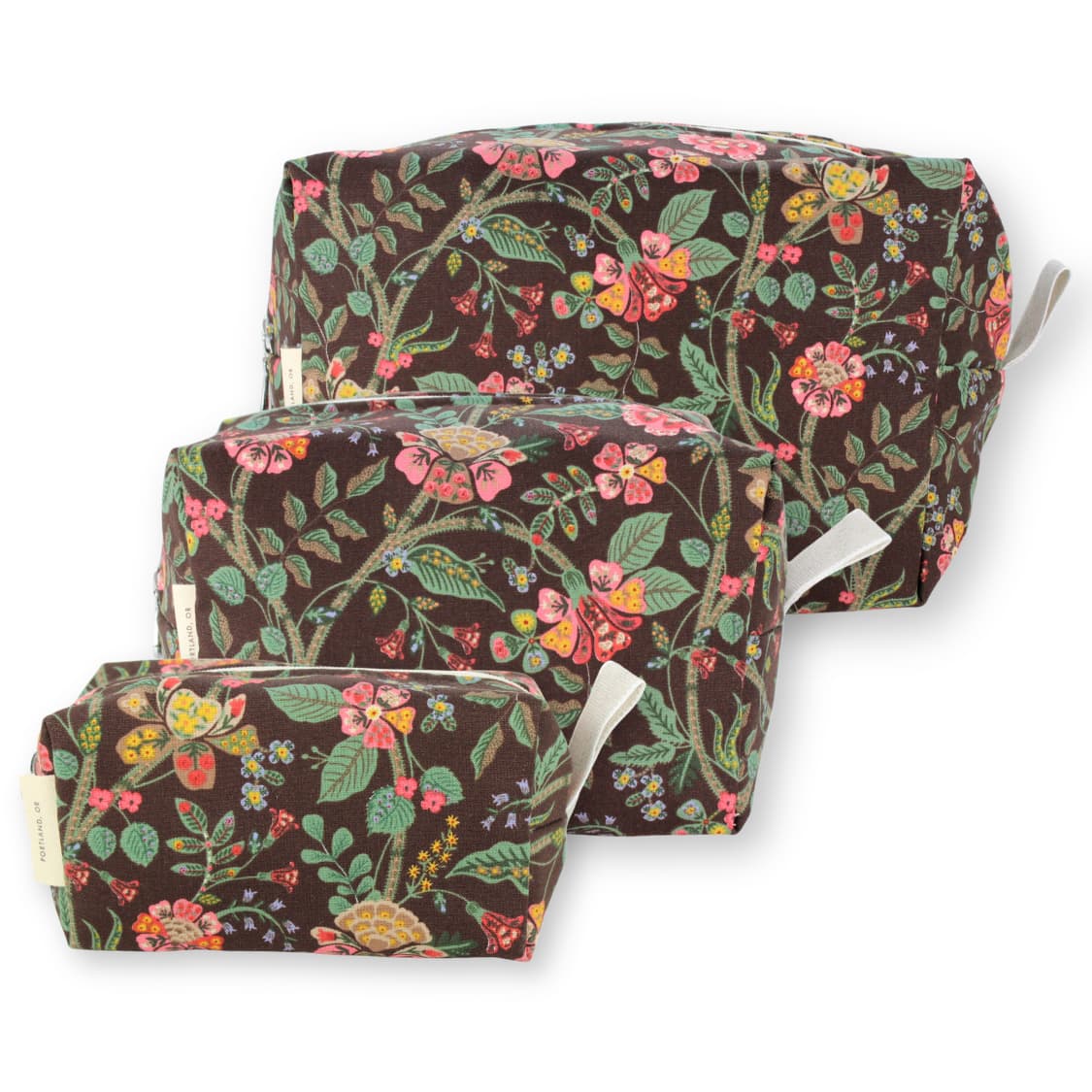 Three nested fabric storage bags with a brown background and a colorful floral print, shown on a white background.