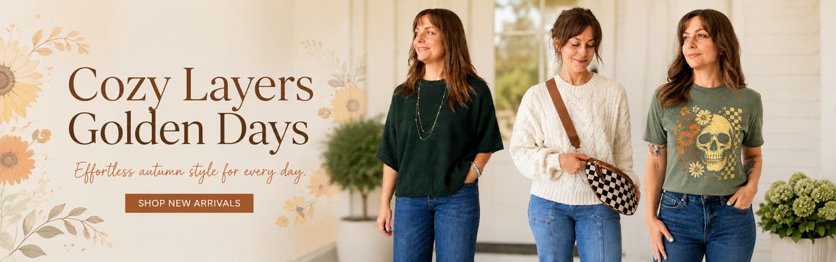 Three women standing indoors wearing layered autumn outfits, with large text on the left reading 'Cozy Layers Golden Days' and a 'SHOP NEW ARRIVALS' button below.