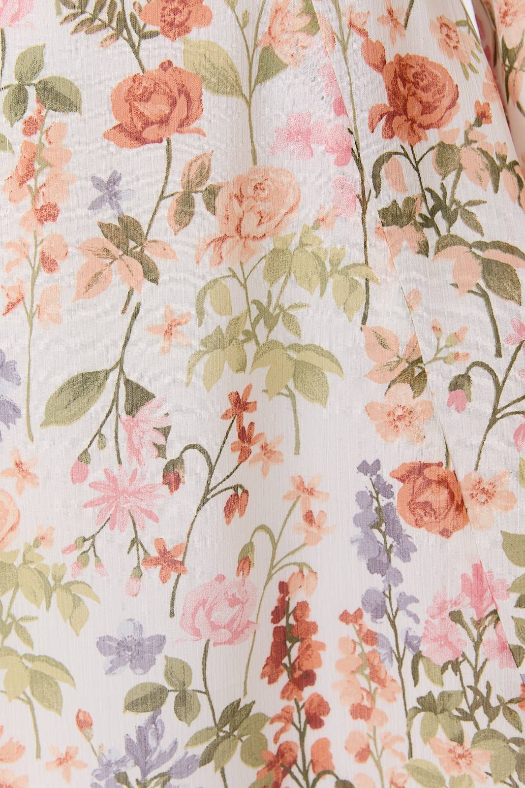 Floral pattern with pink, orange, and purple flowers on a light background