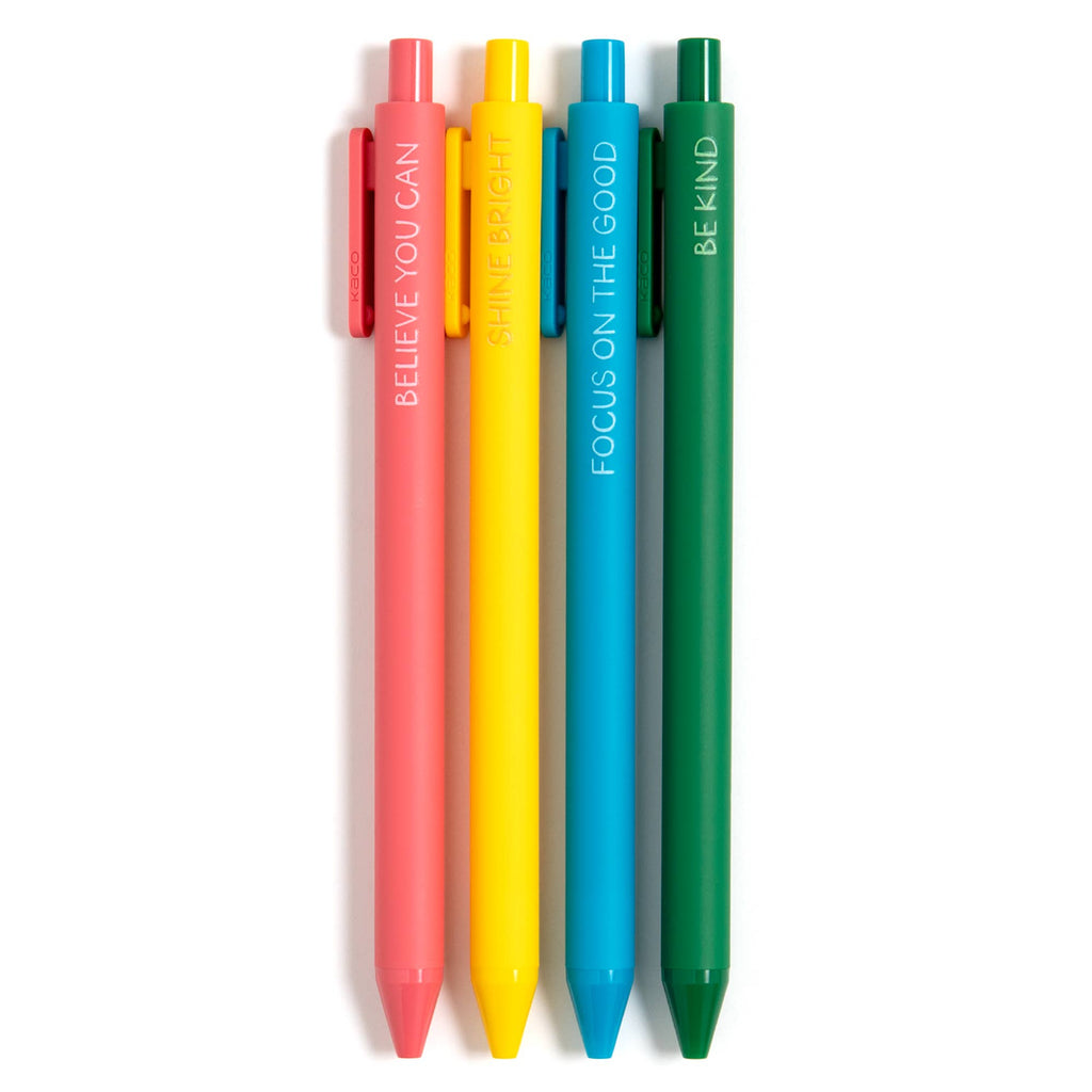 Four colorful pens with motivational phrases on a white background