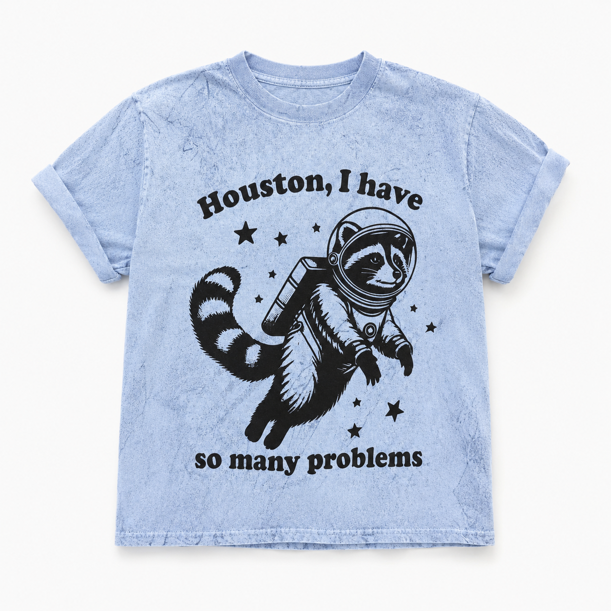 Light blue t-shirt with a raccoon astronaut graphic and text on a white background