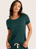 Woman in Forest Green short sleeve bamboo tee shirt.