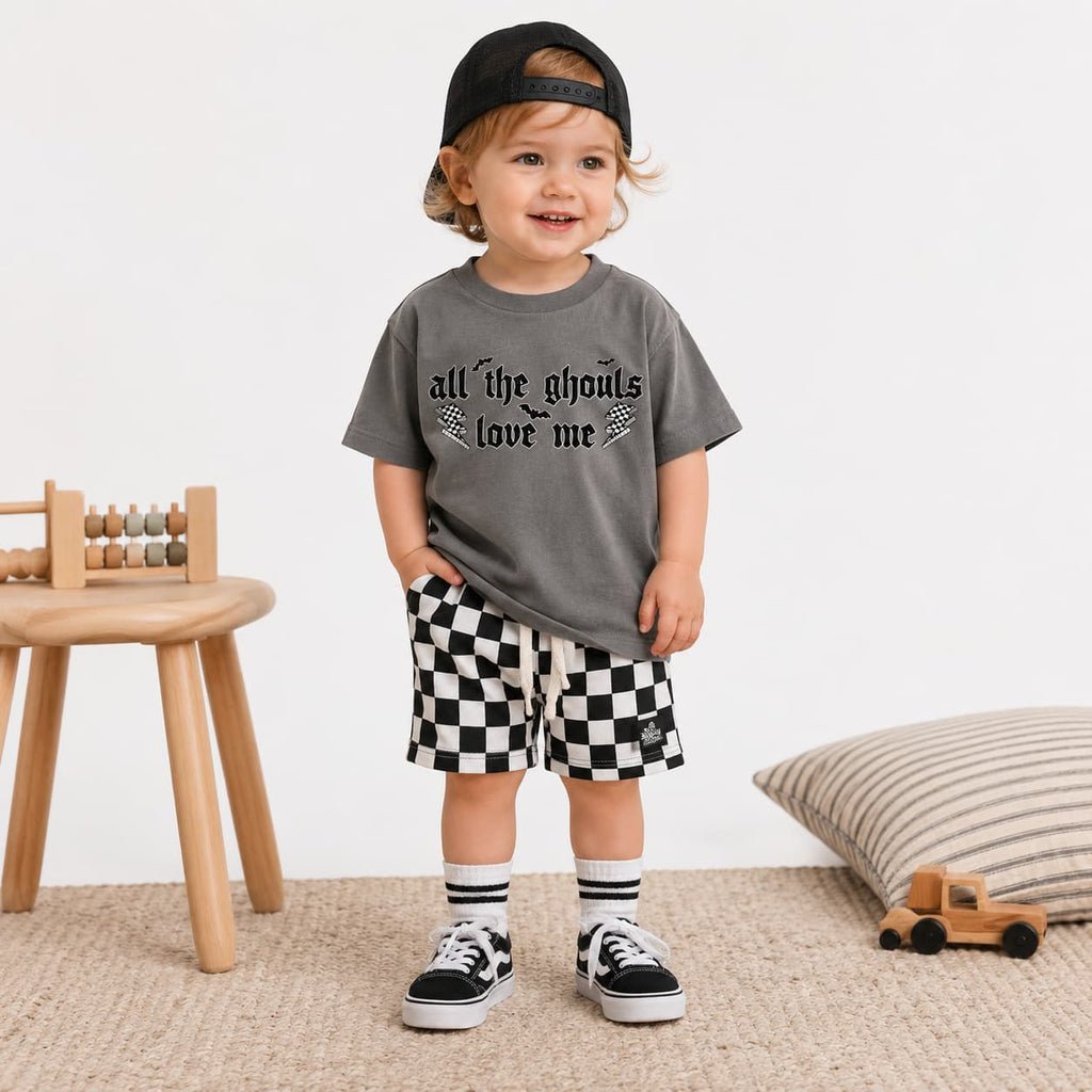 Toddler dressed in trendy fall outfit.