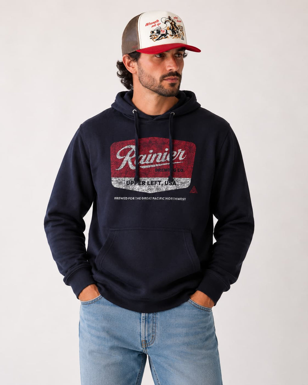 Man wearing Rainier Beer Hoodie and Snapback Hat