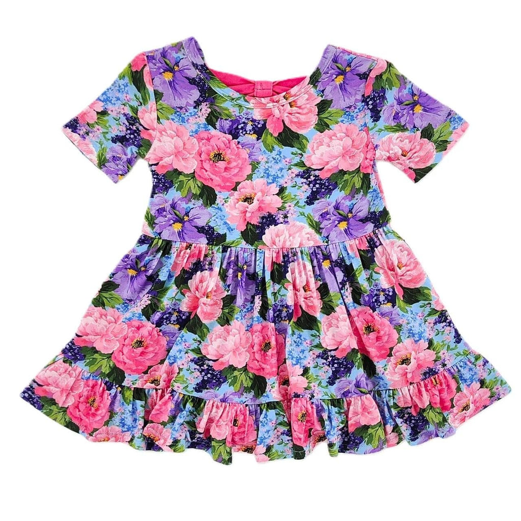 Floral dress with pink and purple flowers on a white background
