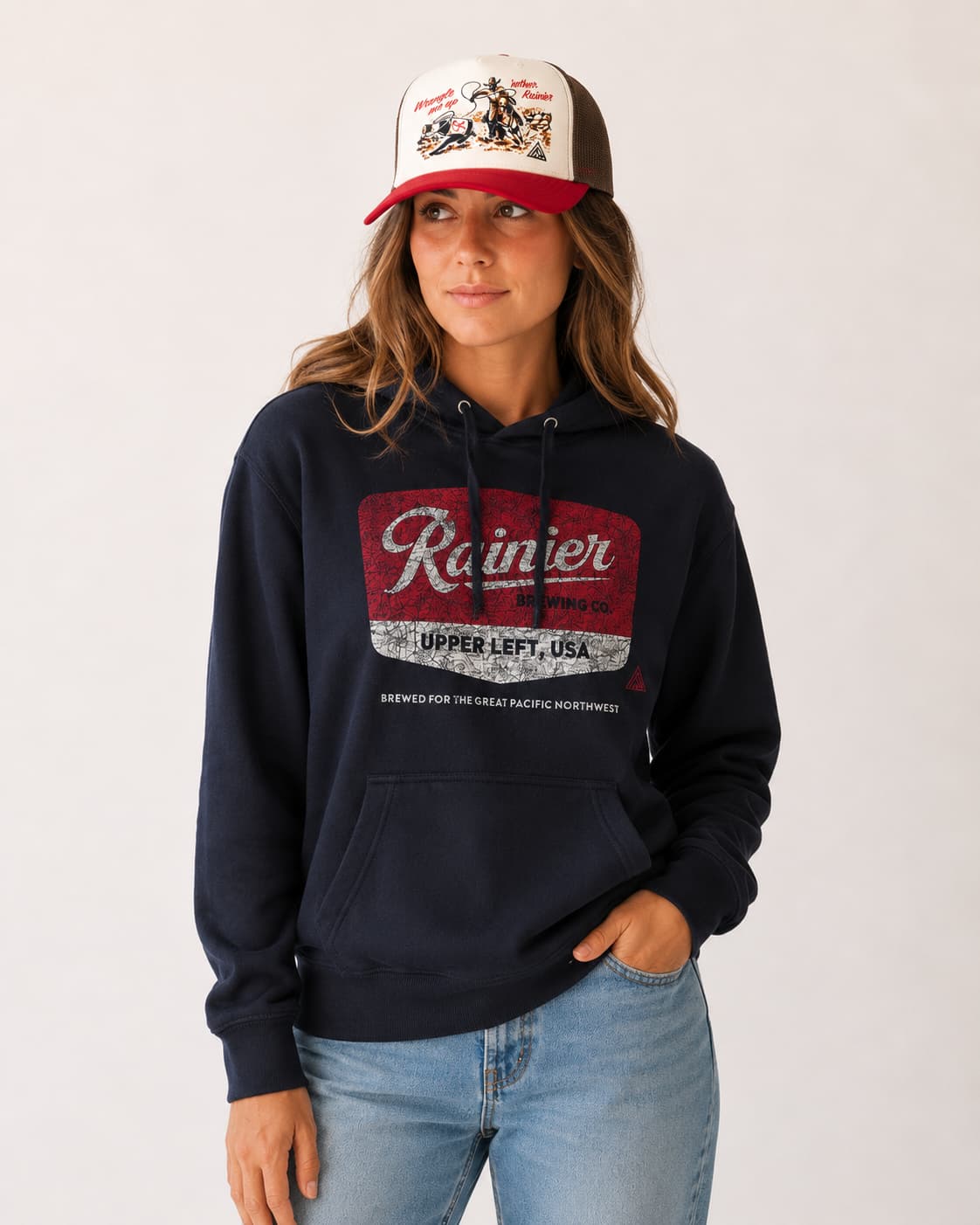 Woman wearing Rainier Beer Hoodie and Snapback Hat